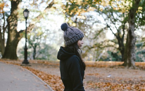 side view of a girl wearing a hat 