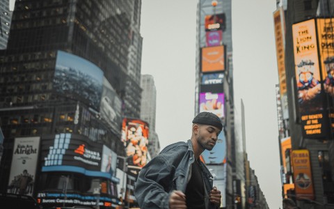 man posing in times square