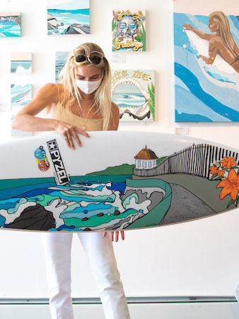 amy nuytkens with surfboard