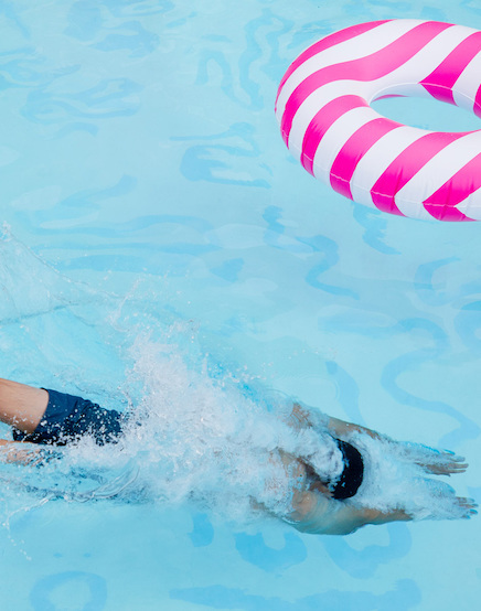 man diving into pool