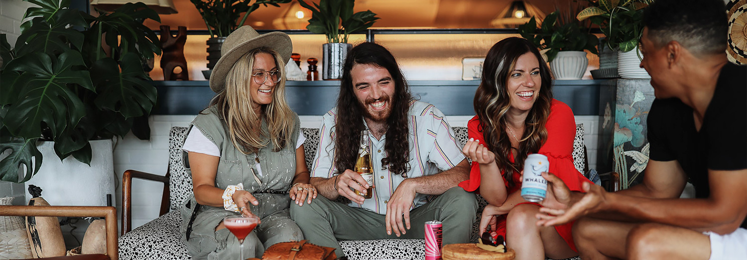 young adults eating and drinking at The Wayfinder Hotel