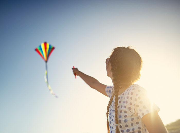 woman flying kite