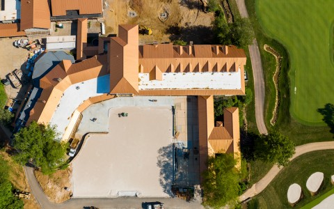 aerial view of the property main building and the golf course