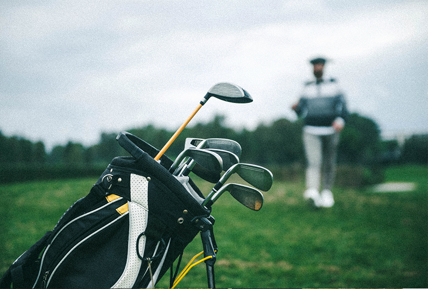 set of golf clubs on a golf course
