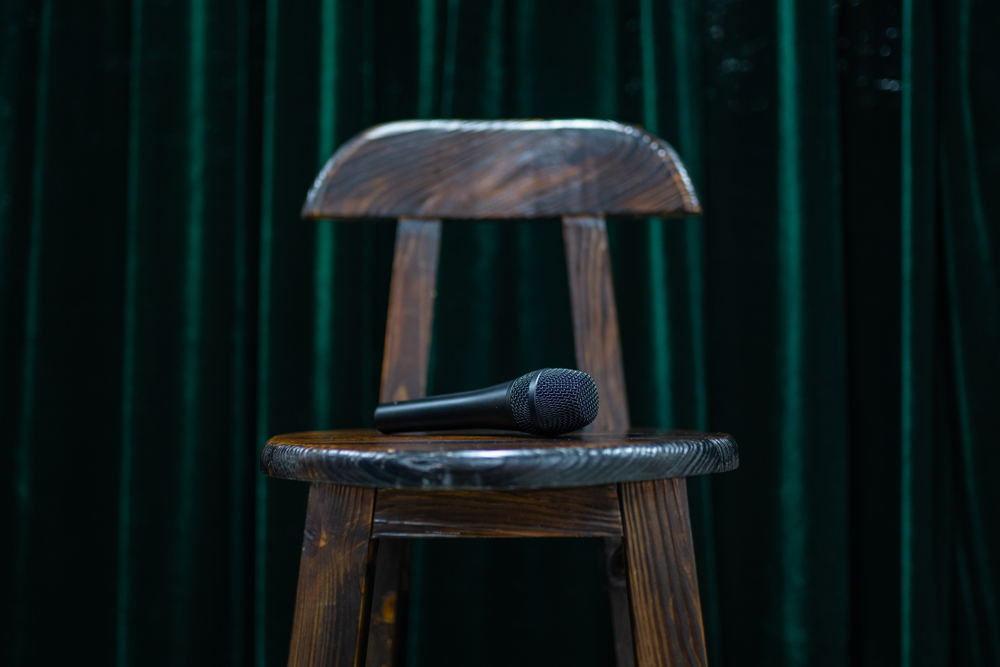 microphone on a bar stool for standup comedy open mic night
