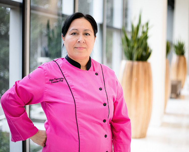chef silva in a pink jacket smiling 