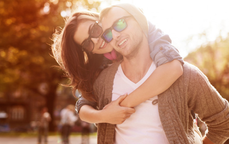 couple in the fall with sunglasses