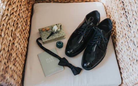 grooms shoes, bowtie, and vows