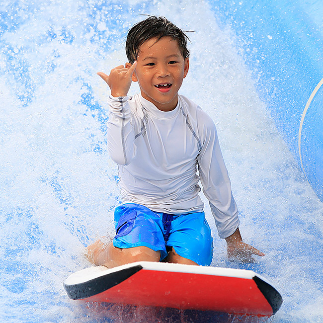 kid riding surfboard