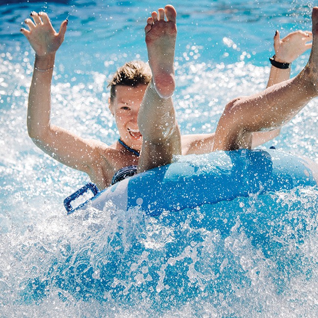 woman riding pool waves