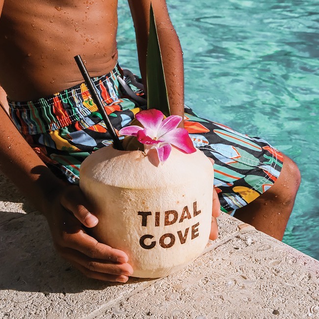man with coconut drink
