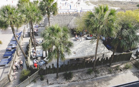 view of the Tiki Hut from above with people relaxing around it