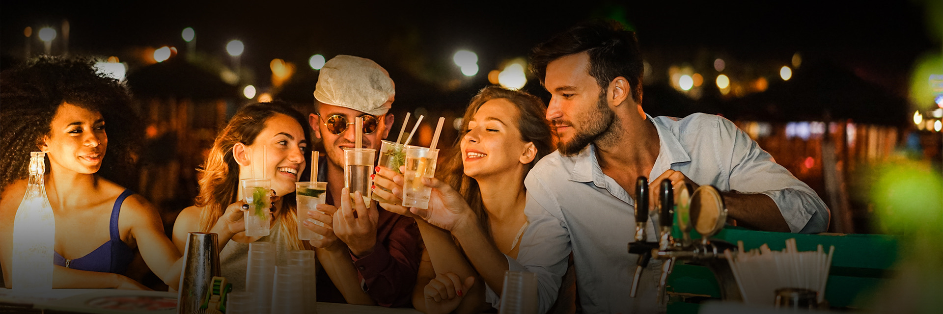 group of friends making a toast with their drinks