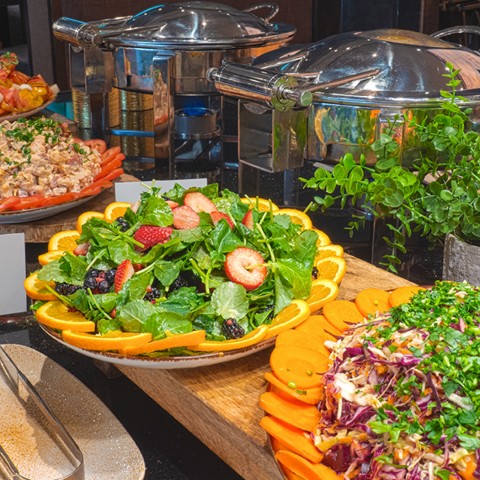 a food buffet with different types of salads