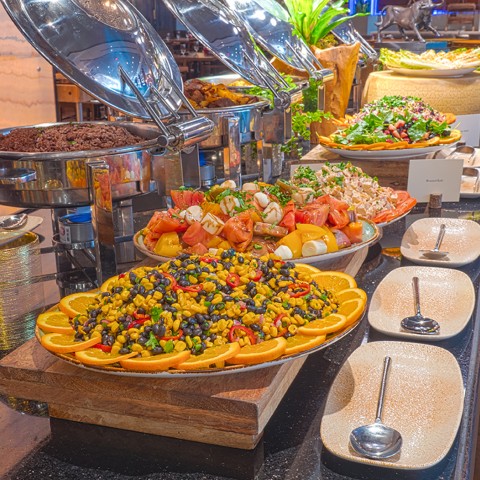 a buffet with rice and different types of veggies