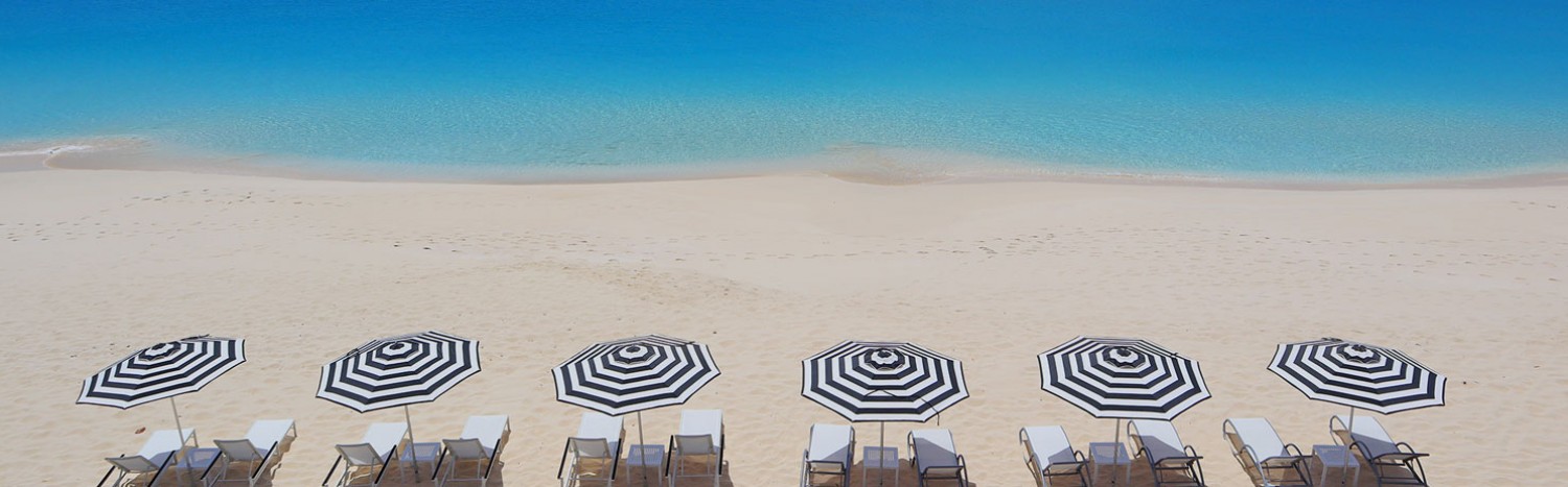 blue beach and parasoles