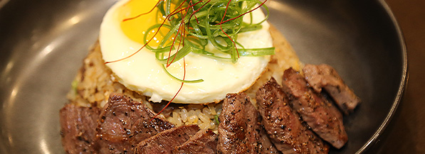 beef with fried egg on top