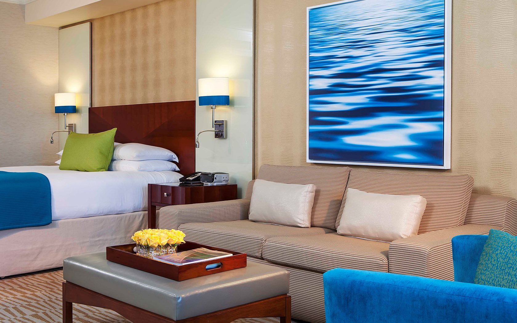 a tropical hotel room with a sofa