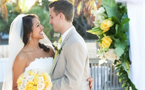 bride and groom looking at each other and smiling