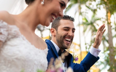 bride and groom laughing together