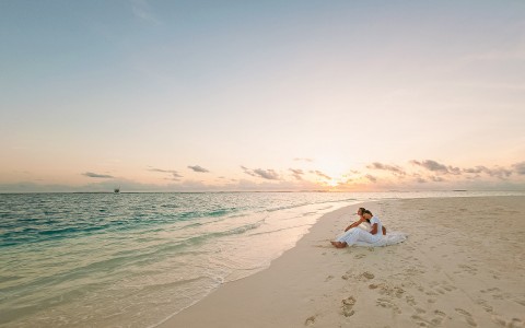 shoreline of a beach at sunrise