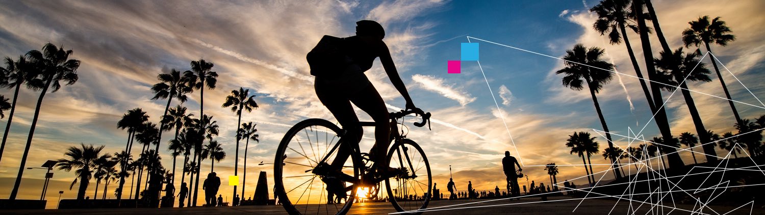 cyclist riding at sunset