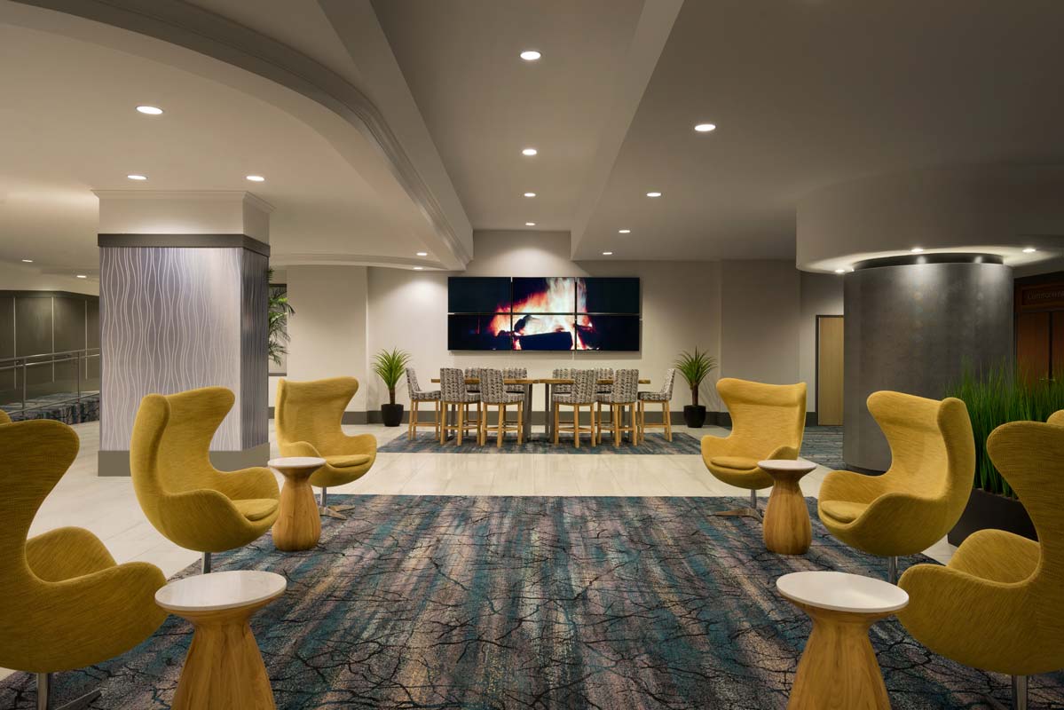hotel lobby with yellow chairs