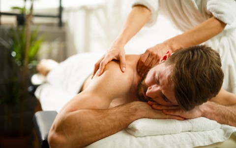 guest enjoying a massage on their back