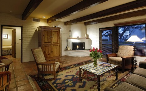 guest room with living room area and a fireplace