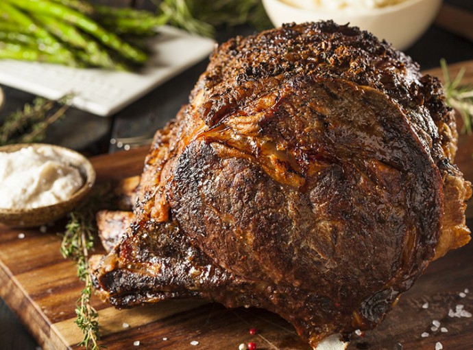 prime rib with butter broccolini mashed potatoes and au jus sauce