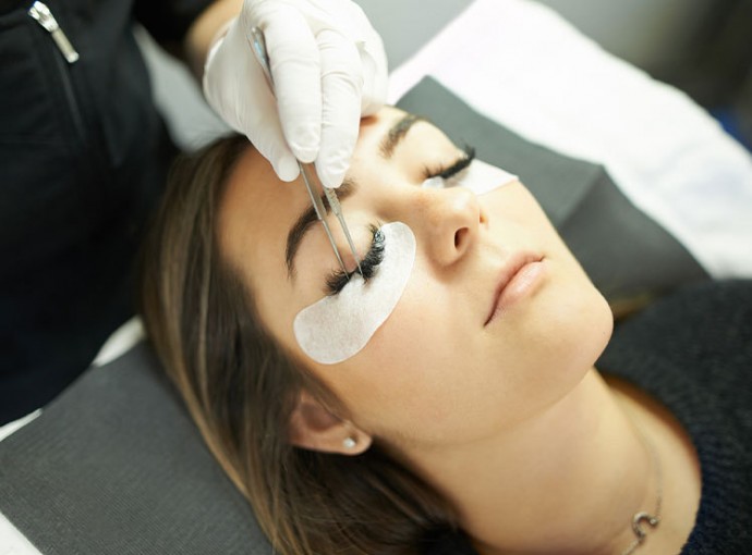 woman getting eye lash extensions 