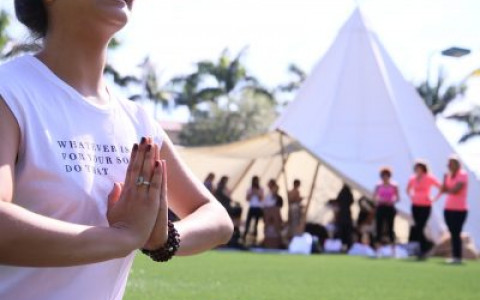 Close up of woman doing yoga at event