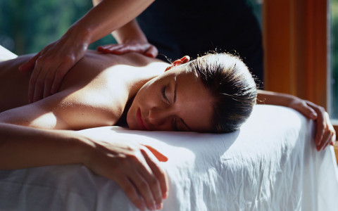woman laying down getting back massasge