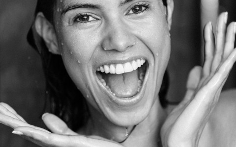 woman smiling in shower