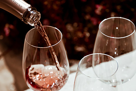 Rose Wine being poured into a wine glass