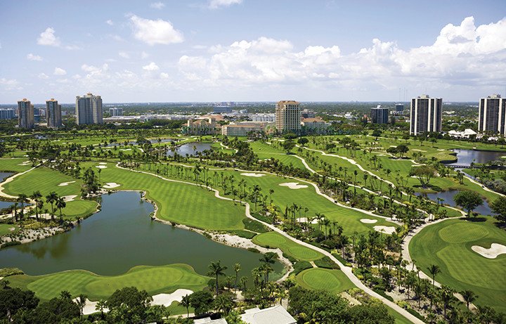 Aerial view of golf course with lakes & sand dunes