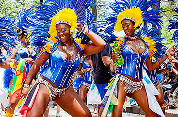 Two women in costume with elaborate headpieces at the Atlanta Caribbean Carnival