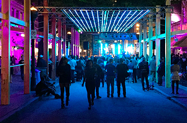 Group of people walking towards a concert area at Elevate Festival