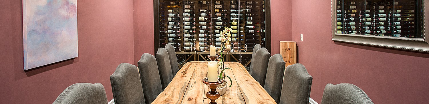 wine cellar with bottles and a wooden table