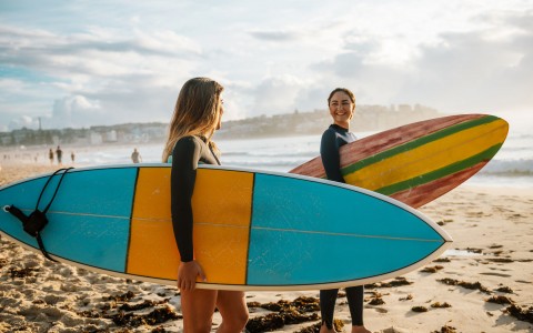 two women going surfing 