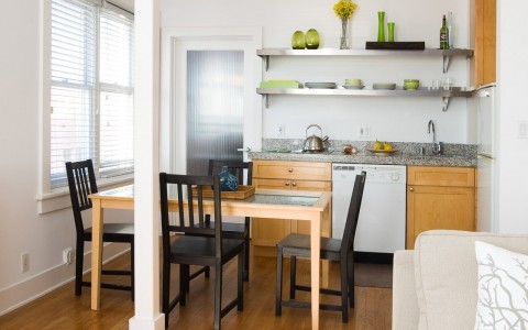 view of kitchenette and small dining table in venice suites studio 