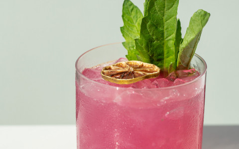 pink Vistal cocktail in rocks glass