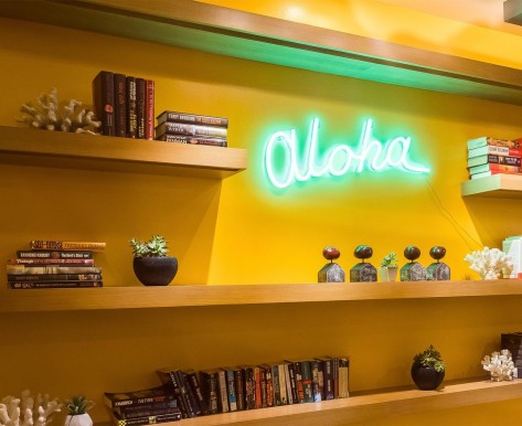 aloha sign next to books