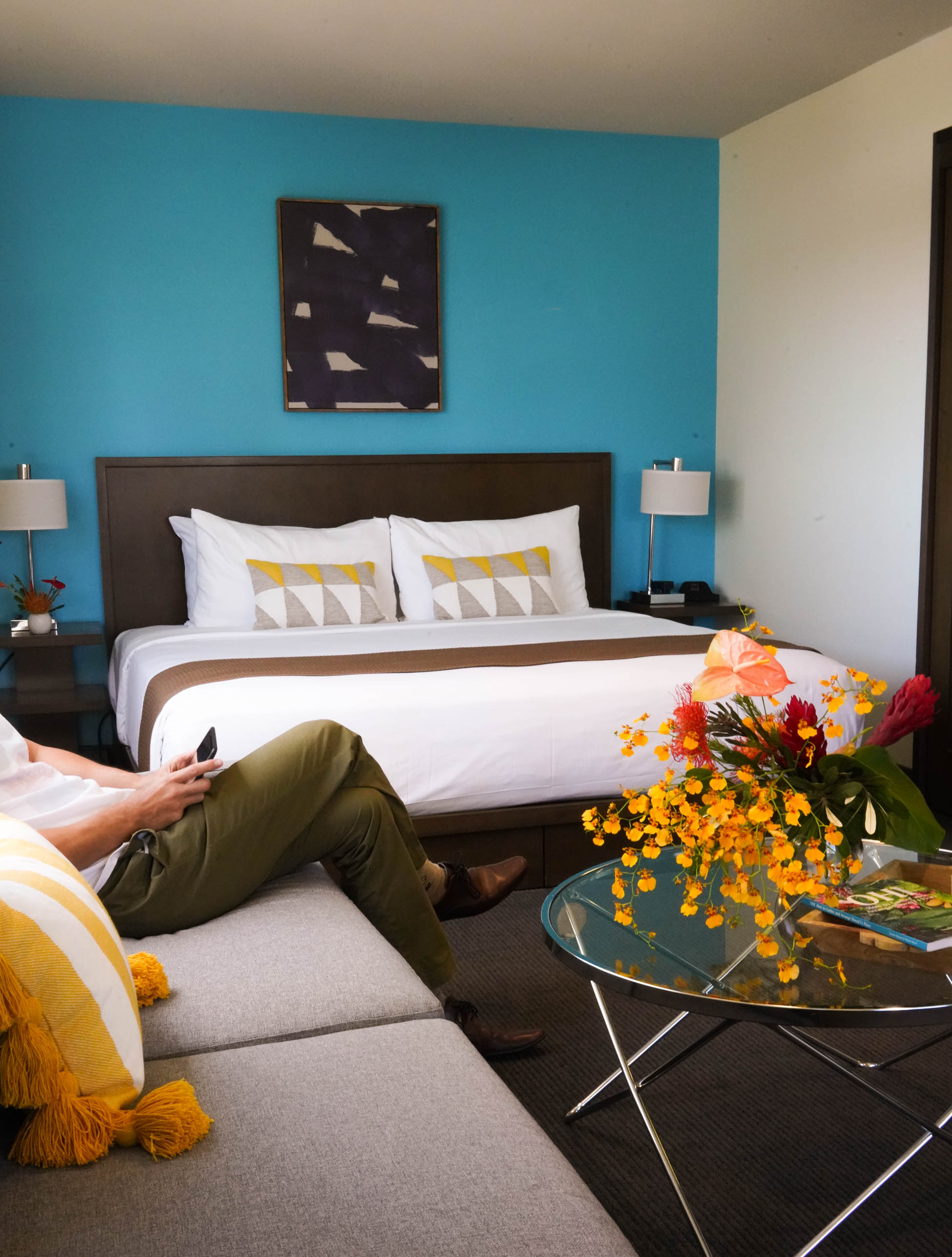bed with mirrors hanging over the headboard