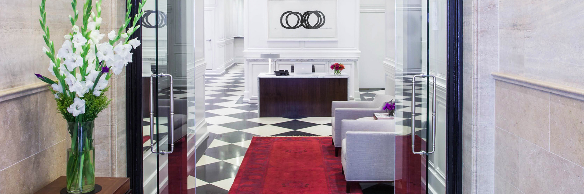 Quaint lobby with checkerboard tiles