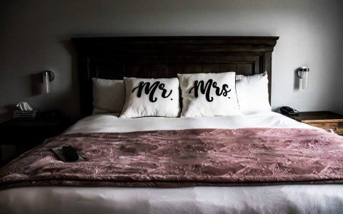Closeup view of a bed hotel room for a married couple