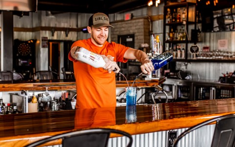 Bartender making a blue lagoon cocktail