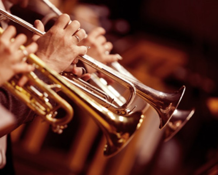 Side view of three trumpet players