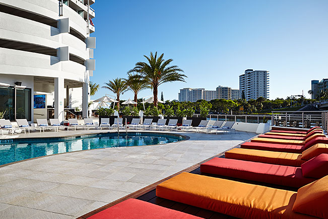 Red & yellow loungers by pool