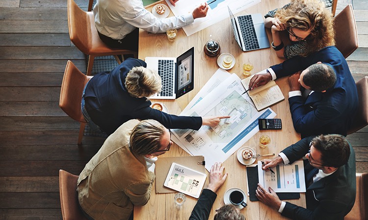 business people sitting at a conference table having a meeting